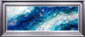 Abstract artwork with blue and white patterns in a silver frame
